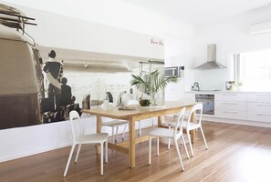 Spacious dining opening onto outdoor servery