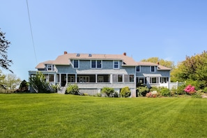 Backyard - large flat yard surrounded by tall hedges for privacy