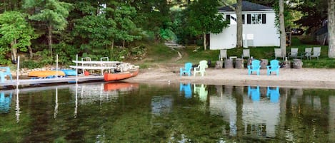 Lake Side  Sandy swimming area.  The dark spots are leaves from recent storm