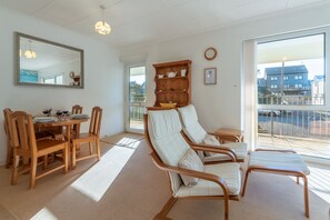 12 Westward Flats, Polzeath. First floor: Balconied entrance into the open-plan sitting/dining area