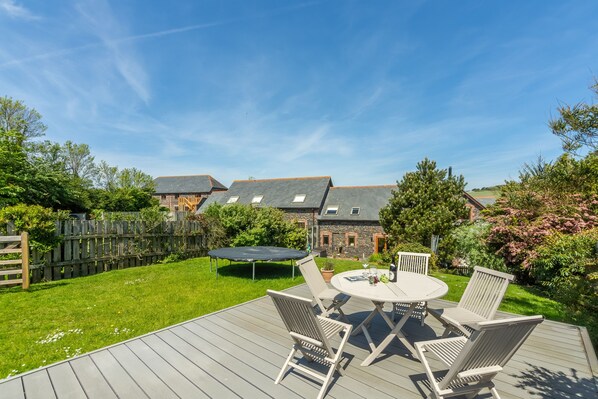 Curlews Cwtch, Roserrow. Large enclosed garden to the rear, with a well-equipped patio area and charcoal barbecue