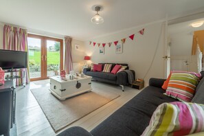 Curlews Cwtch, Roserrow. Ground floor: Sitting room opening out onto garden