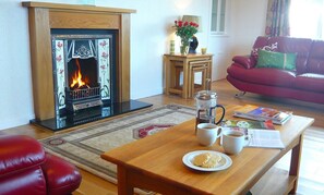 Lounge with open fire and sea view