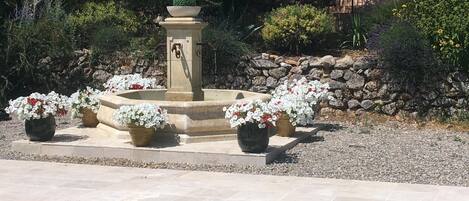 Provençal fountain beside the pool