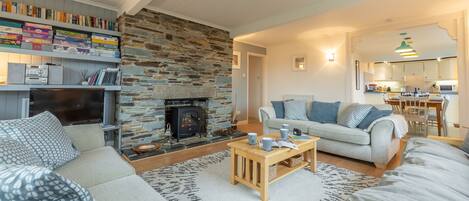 Palm Trees, Polzeath. Ground floor:  Sitting room with feature fireplace and electric fire and delightful balcony