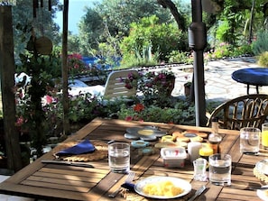 Orchard Villa - breakfast on patio, terraced garden / pool beyond