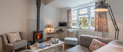 Miss Fishers, Port Isaac. Ground floor:  Sitting room with cosy wood burning stove