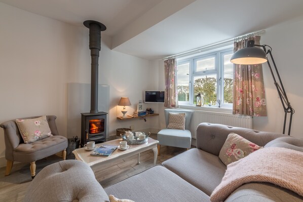 Miss Fishers, Port Isaac. Ground floor:  Sitting room with cosy wood burning stove