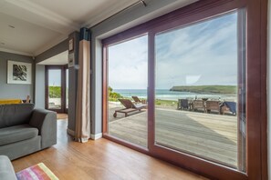 Pentewan, Polzeath. Ground floor:  Sitting room leading out to sun-deck