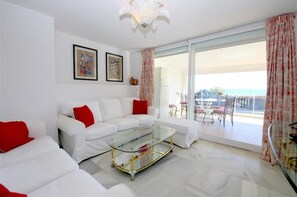 Another view of the lounge area with comfortable seating for five guests