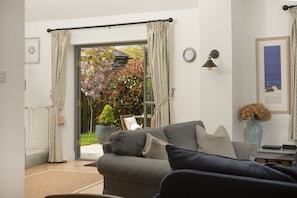 Wedge Cottage, Roserrow. Ground floor: Doors leading out to the enclosed patio and garden