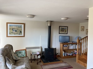 Living room with cosy woodburner