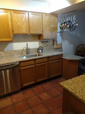 Fully Equipped kitchen has granite countertops 