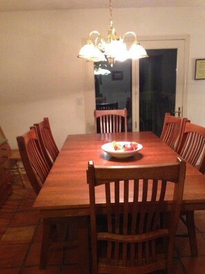 Roomy solid wood dining room table.  Has an extra leaf so can be expanded.