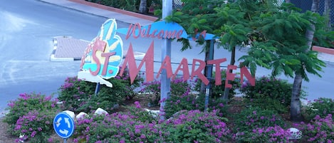 Attractive welcoming sign to the entrance of Maho Village.