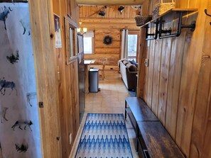 Entry way with space for shoes and coats storage.