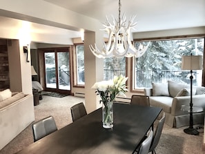 Living and Dining Area. Curl up in 2 oversized corner chairs