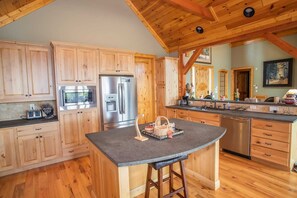 Large Accommodating Kitchen with Stainless Steel Appliances and Large Island