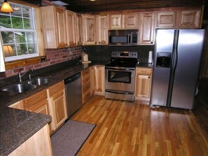 Brand new gourmet kitchen with granite counters & stainless appliances!