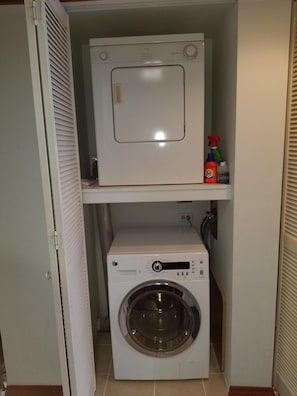We have a stack washer and dryer in our condo for your convenience.