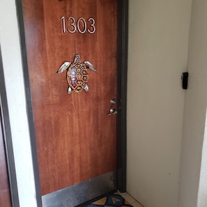 Entrance to 1303 and our beautiful apartment with a turtle cove theme.