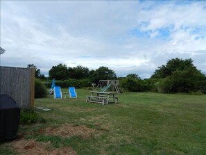 Picnic table, chairs and play structure all for your use.