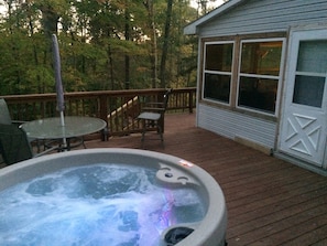Enjoy the hot tub while overlooking the forest