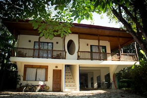 The Main House.  One bedroom downstairs, three upstairs all with AC.