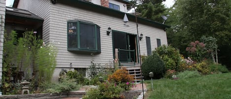 Entrance to House surrounded by gardens