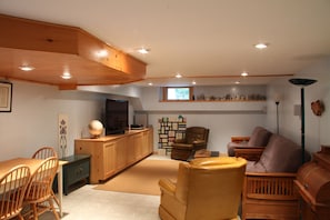 Basement Family Room has large TV, and fold out futons for extra bedding