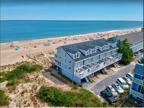 Aerial view of our building, beach, and private parking. (We are 4th from left)