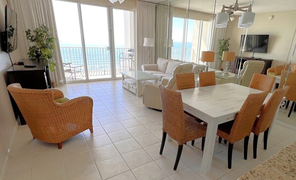 Endless water views from living, dining, kitchen.  Slipcovered sofa. Roku 55 TV.