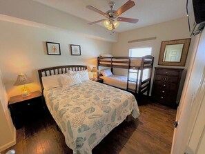 Guest bedroom sleeps up to four in a queen bed and juvenile bunk beds. 