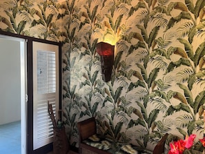 Tommy Bahama wallpaper in the entryway
