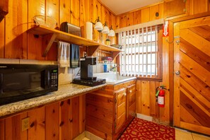 Old farm sink, modern appliances, Granite counters, with back door to back deck