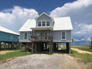 At the end of a cul de sac and away from traffic with parking under house