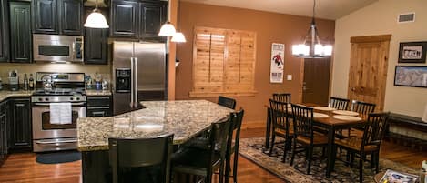 Beautiful kitchen and dining room area. Granite counters and hardwood floors.