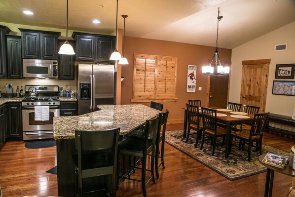 Beautiful kitchen and dining room area. Granite counters and hardwood floors.