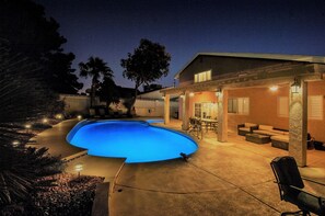 Large pool and spa, fire pit, dining table, lounging sectional and chairs, BBQ