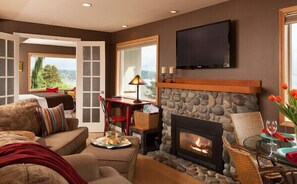 Cottage living room with fireplace and flat screen TV