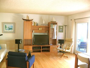 Living area opens onto the patio and garden.