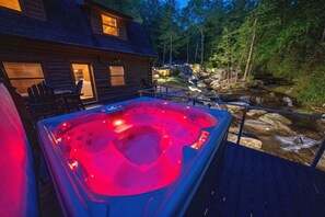 Hot tub deck overlooks the stream. Great location for star gazing at night!