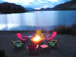 Evening bonding around the campfire overlooking the serene lake.