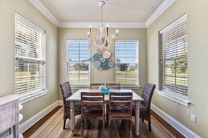 Kitchen and dining area with table seating for 6 and counter seating for 4.