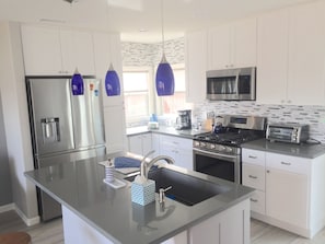 Fully stocked kitchen with dishwasher