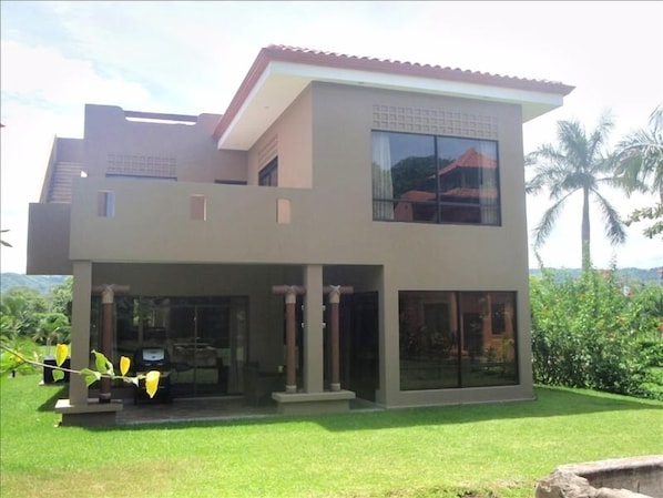 outdoor seating area with gas grill..close to pool and ocean.