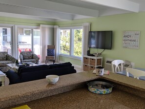 View of living area from kitchen - sliders to main deck