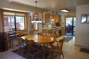 Kitchen view and table with room for 6 - additional leaves and chairs for 10