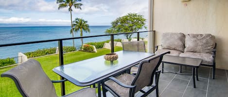 Lanai offers dining seating for four guests & lounge seating for two more.