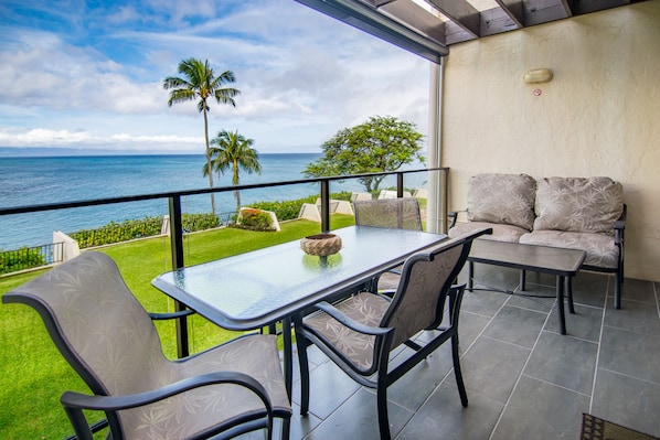 Lanai offers dining seating for four guests & lounge seating for two more.
